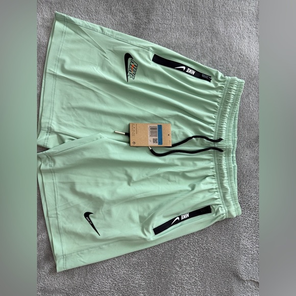 Nike Light Green Sports Shorts with Black Accents - Picture 1 of 4